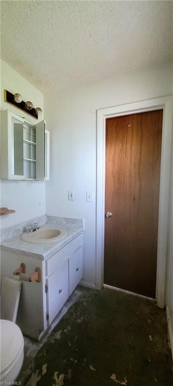 305 Corliss St, Greensboro, NC 27406 - bathroom with vanity, a textured ceiling, and toilet