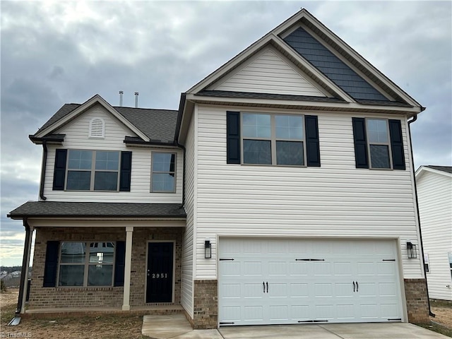 view of front of home featuring a garage and covered porch