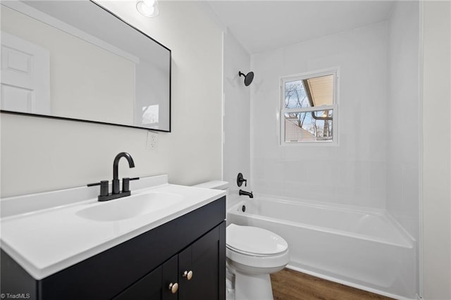 full bathroom featuring vanity, shower / bathing tub combination, toilet, and wood finished floors