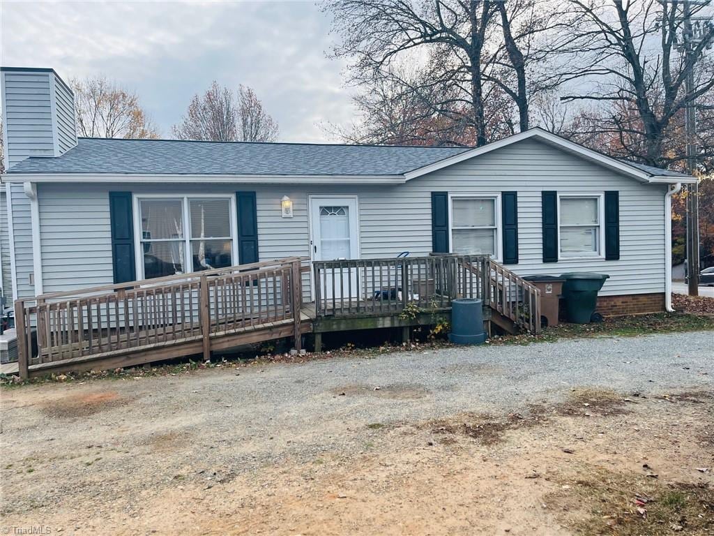 ranch-style house with a deck