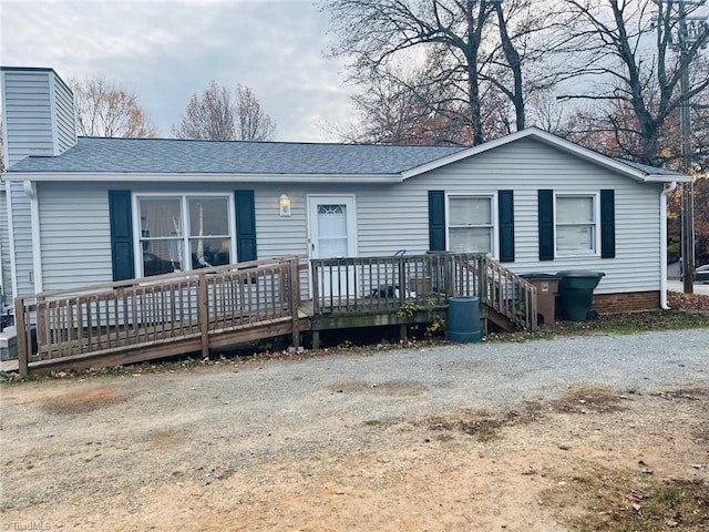 ranch-style house with a deck