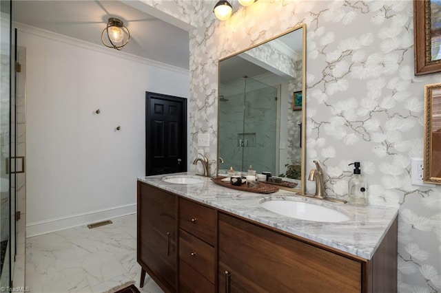 full bath featuring a marble finish shower, double vanity, ornamental molding, a sink, and marble finish floor