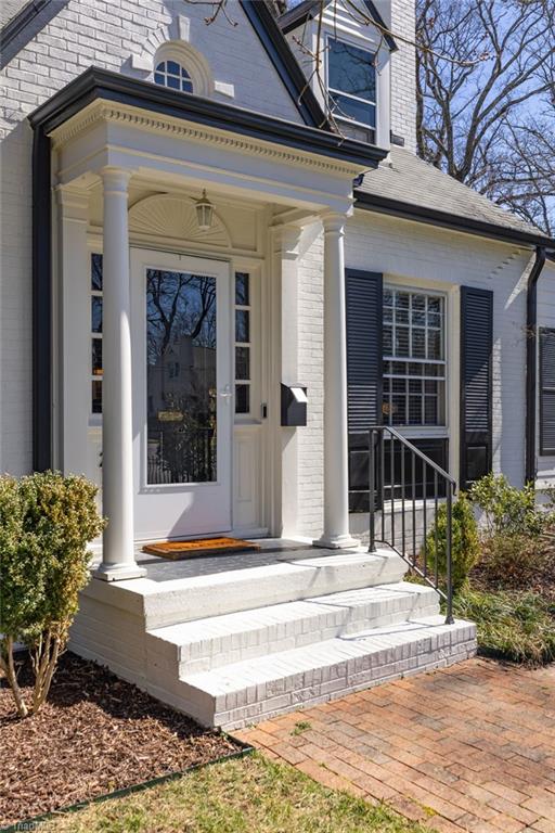 entrance to property with brick siding