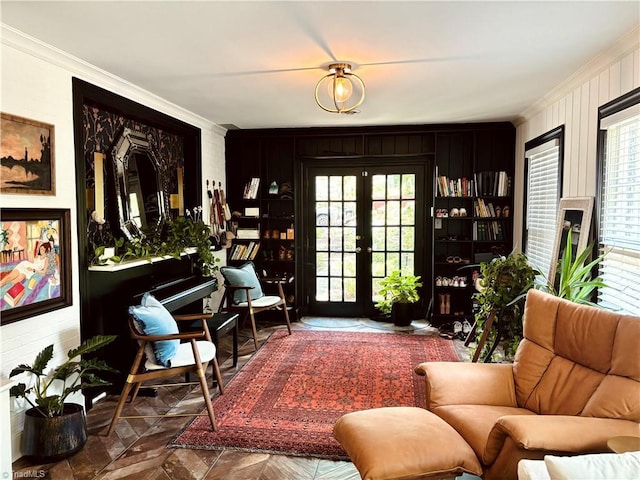 sitting room with french doors and ornamental molding