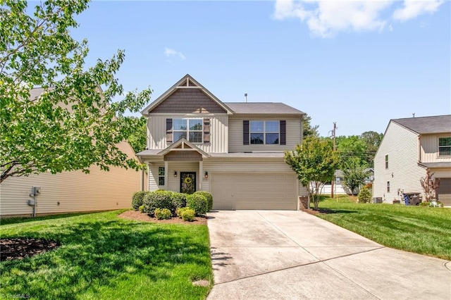 craftsman-style home featuring a garage, a front lawn, board and batten siding, and concrete driveway