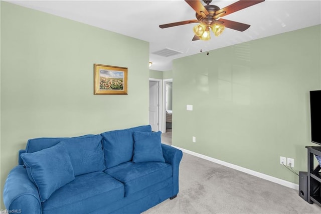 carpeted living room featuring baseboards, a ceiling fan, and visible vents