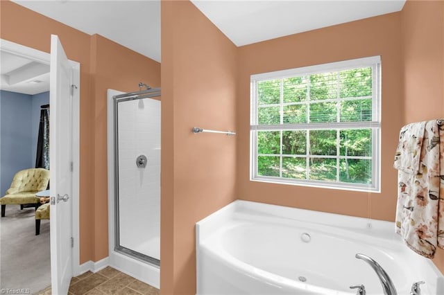 full bathroom with a stall shower and a bath