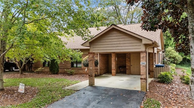 view of front of property with a carport