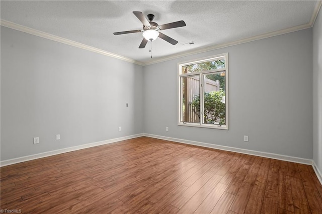 empty room featuring wood-type flooring, a textured ceiling, ceiling fan, and crown molding