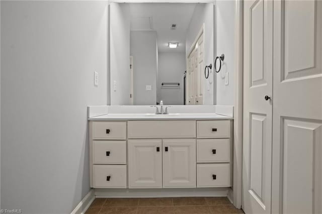 bathroom with tile patterned floors and vanity