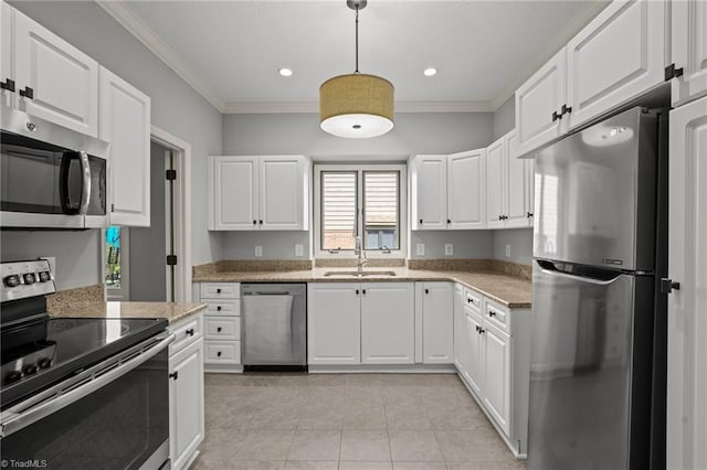 kitchen featuring hanging light fixtures, sink, white cabinets, and stainless steel appliances