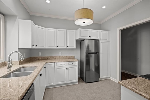 kitchen featuring white cabinets, decorative light fixtures, sink, and appliances with stainless steel finishes