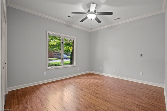 empty room featuring wood-type flooring, ceiling fan, and ornamental molding