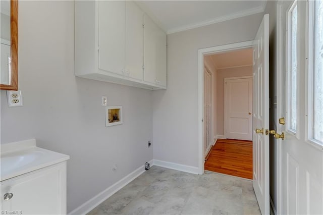 laundry room featuring hookup for a washing machine, baseboards, hookup for an electric dryer, cabinet space, and ornamental molding