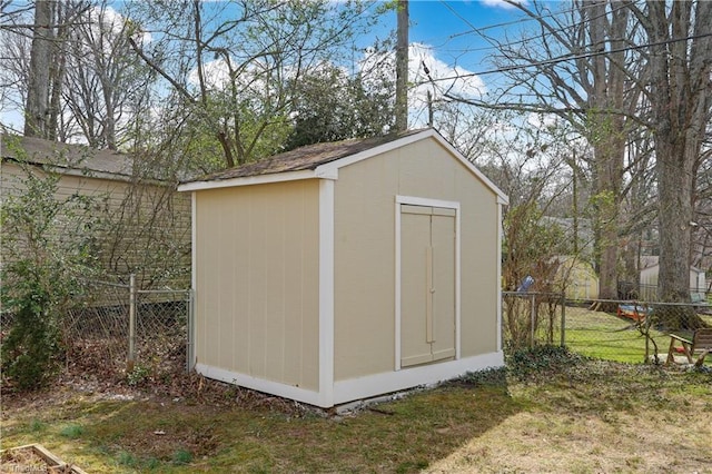 view of shed with fence