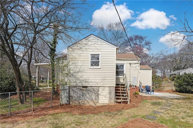 exterior space with crawl space and fence