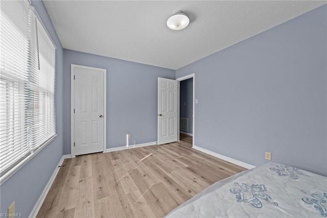 unfurnished bedroom featuring light hardwood / wood-style flooring