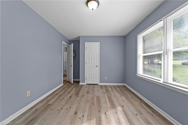 unfurnished bedroom with light hardwood / wood-style flooring