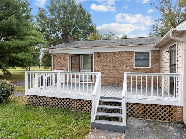 back of property featuring a deck