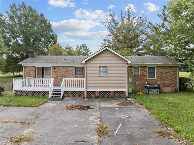 back of house featuring a deck