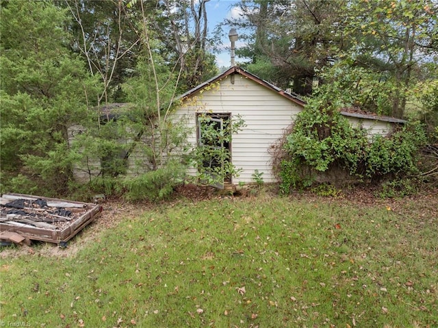 view of property exterior with a yard