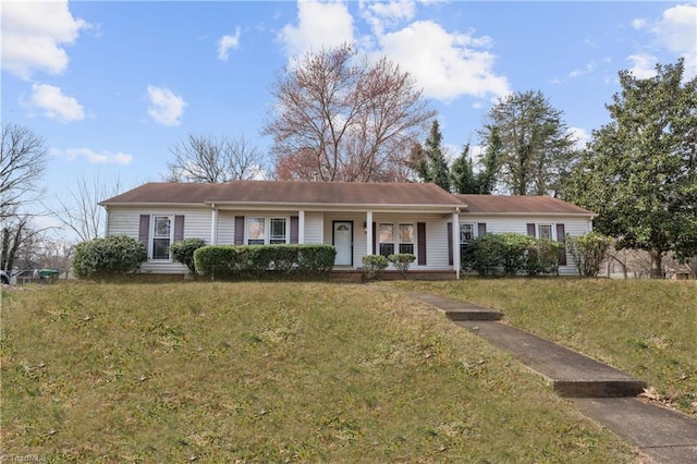 ranch-style home featuring a porch and a front yard