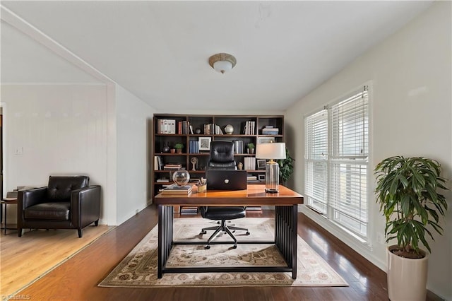 office area featuring baseboards and wood finished floors