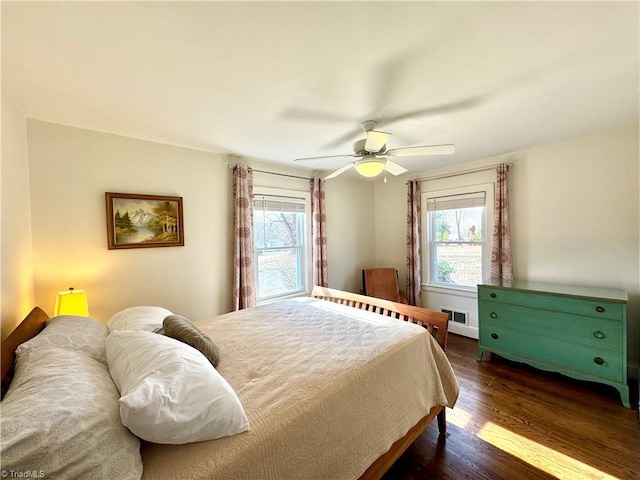 bedroom with dark wood-type flooring and ceiling fan