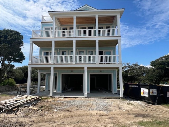 view of front of home with a balcony and a garage