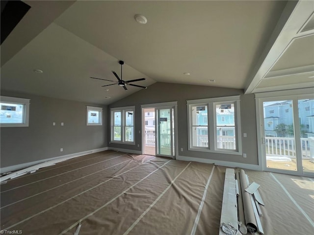 interior space featuring vaulted ceiling and ceiling fan