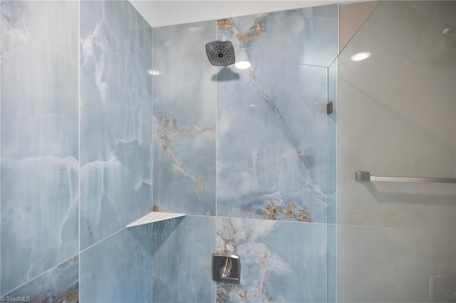 full bathroom with tiled shower