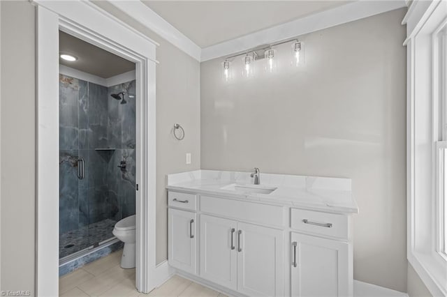 full bath featuring toilet, a stall shower, and vanity