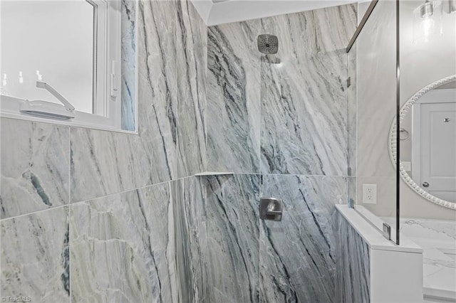 room details with a marble finish shower