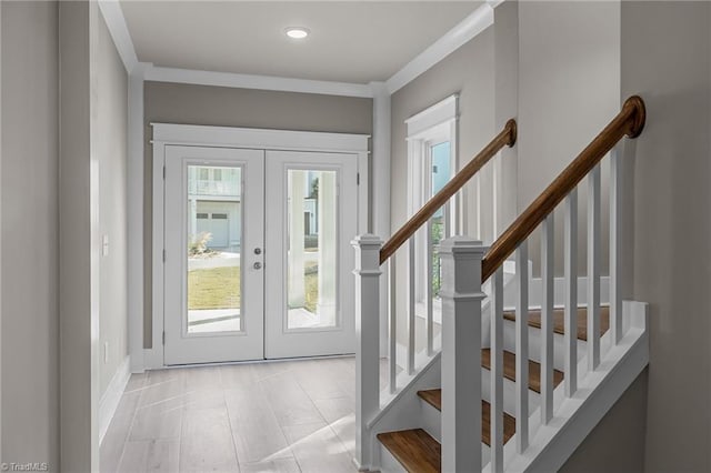 entrance foyer featuring stairs, light tile patterned floors, french doors, and crown molding