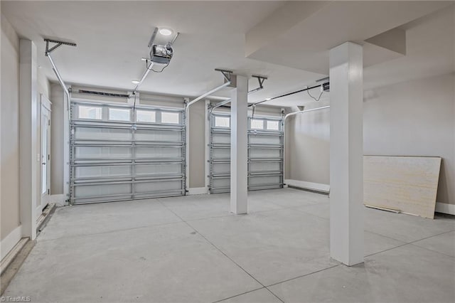 garage featuring baseboards and a garage door opener