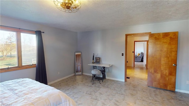 bedroom featuring a textured ceiling