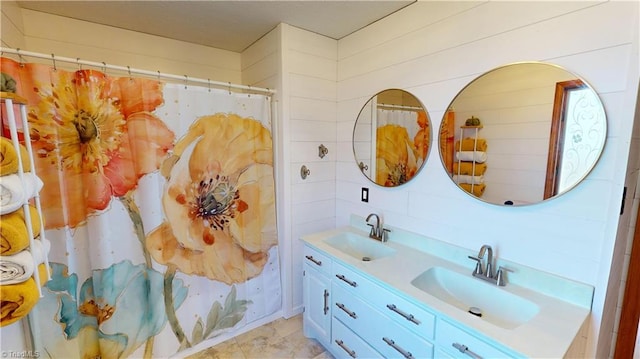 bathroom with vanity and curtained shower