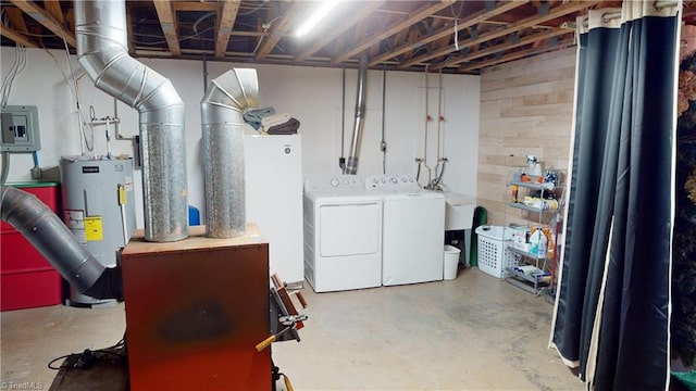 basement with separate washer and dryer, electric panel, and water heater