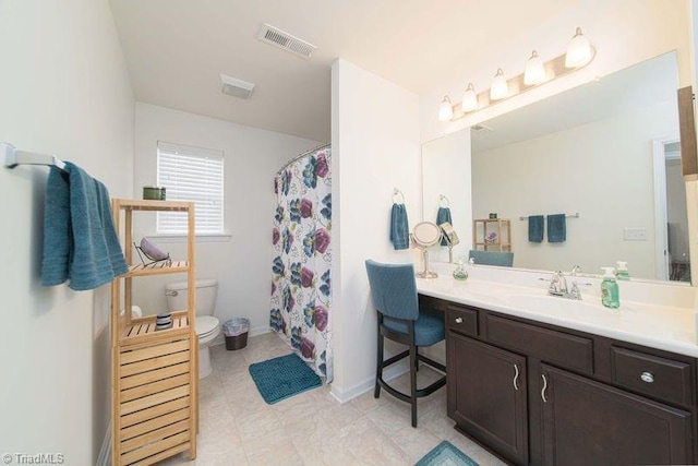 bathroom featuring toilet, vanity, baseboards, and a shower with shower curtain