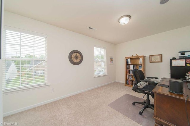 carpeted office with baseboards