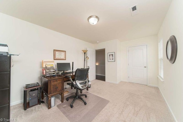 carpeted office with baseboards