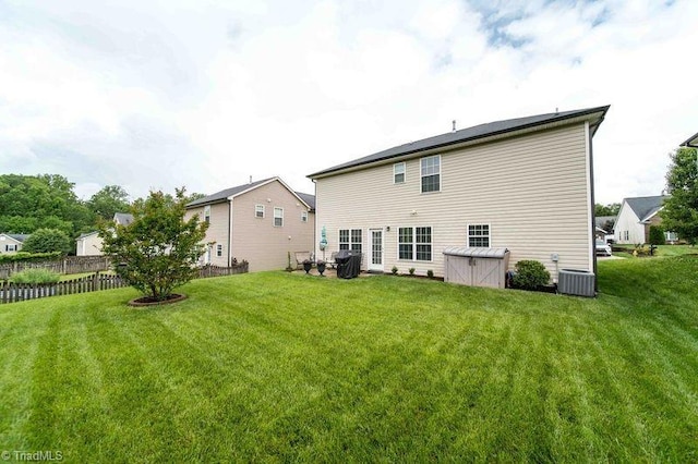 rear view of property featuring cooling unit