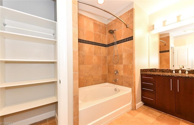 201 N Elm St Unit 310, Greensboro, NC 27401 - bathroom with tub / shower combination, vanity, tile patterned floors, and baseboards