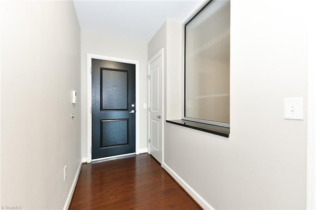201 N Elm St Unit 310, Greensboro, NC 27401 - doorway to outside featuring dark wood-style flooring and baseboards