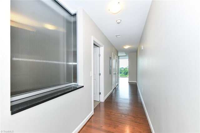201 N Elm St Unit 310, Greensboro, NC 27401 - corridor featuring wood finished floors and baseboards