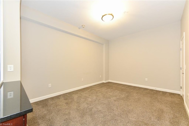 201 N Elm St Unit 310, Greensboro, NC 27401 - unfurnished room featuring carpet floors and baseboards