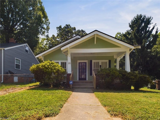 bungalow-style house featuring a front yard