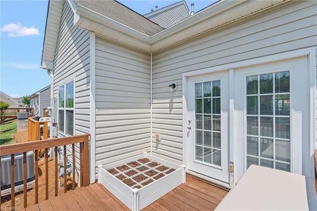 wooden terrace featuring central air condition unit
