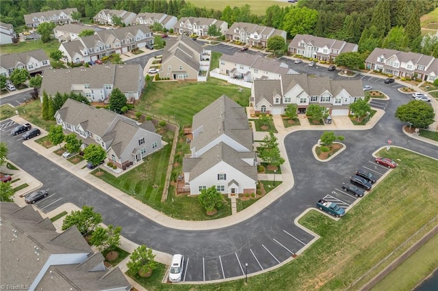 birds eye view of property with a residential view