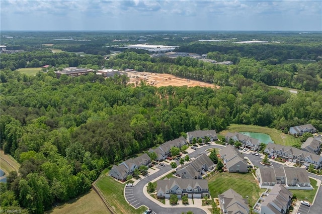 birds eye view of property with a water view, a forest view, and a residential view